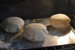 Pita bread is just the right size for a sandwich. Better than a bun, it doesn't get soggy when loaded down with tzatziki, hummus, or lamb and hot sauce. Pita bread is a must for gyros and schwarma. And it's pretty quick to make. You don't even need to wait for the bread to rise a second time before you bake it.