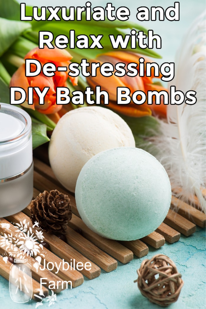 bath bombs on a wooden mat with two orange tulips and a white feather in the background.