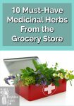 A red first aid kit with herbs and flowers inside