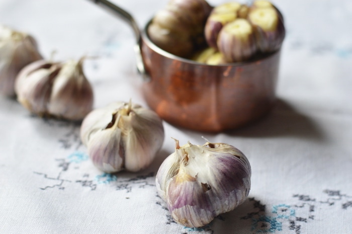 Roasted garlic is sweet, and complex, without the burning sensation of raw garlic. Roasted garlic has been cooked at low temperatures that caramelize the sugars, naturally occurring in all alliums. This gives roasted garlic a complex, delicious, warmth, not found on the supermarket shelf. Top chefs know this and incorporate roasted garlic in sauces, soups, dips, and meat dishes. But you don't have to spend big money at a fancy restaurant to enjoy the flavours of roasted garlic. It's easy to make it at home, and doesn't even take extra time.