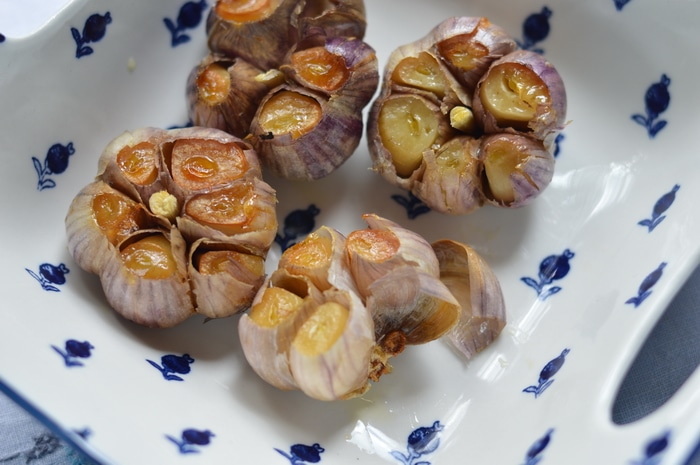 Roasted garlic is sweet, and complex, without the burning sensation of raw garlic. Roasted garlic has been cooked at low temperatures that caramelize the sugars, naturally occurring in all alliums. This gives roasted garlic a complex, delicious, warmth, not found on the supermarket shelf. Top chefs know this and incorporate roasted garlic in sauces, soups, dips, and meat dishes. But you don't have to spend big money at a fancy restaurant to enjoy the flavours of roasted garlic. It's easy to make it at home, and doesn't even take extra time.