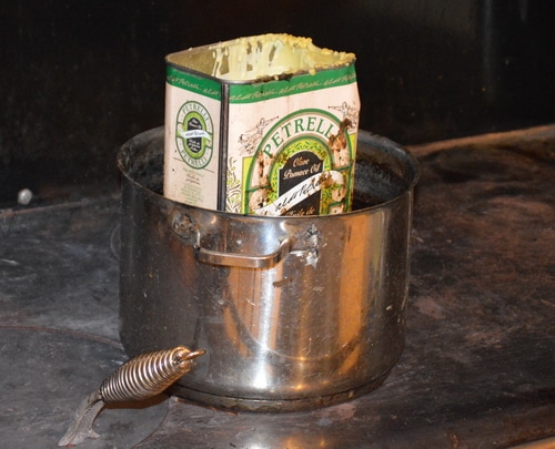 Candle wax heating up on the stove in a pot
