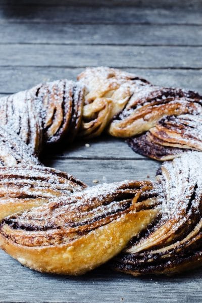 Cinnamon twist bread sitting on an old table