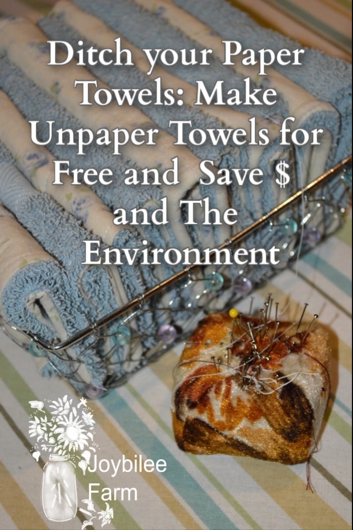 freshly sewn unpaper towels in a reusable basket with a pin cushion in front