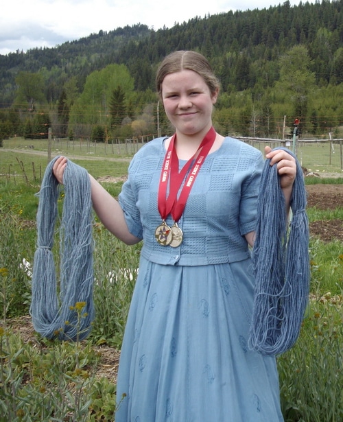 Sarah with yarn dyed with woad and her medals received for winning 2 consecutive years at the Canadian science fair