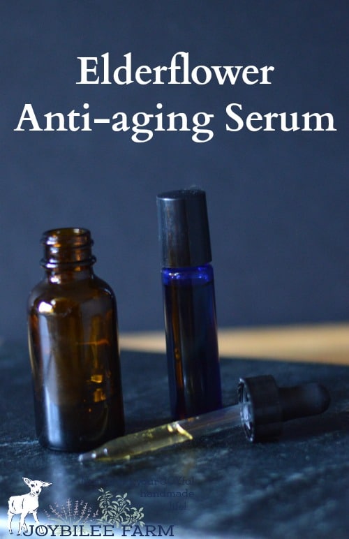 Elderflower serum in a dropper bottle, and in a roller bottle on a blue background