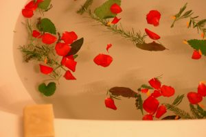 a delightful, cup of herbal tea, and an intimate journey into her garden and her very personal bathing and self-care rituals. The cup of tea is the size of a claw foot bathtub, served in a secluded corner of her garden. 