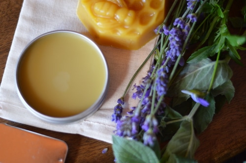 This soothing headache salve can be made from fresh lavender blossoms and peppermint leaves from your garden. If you don’t have any in your garden you can use dried leaves and dried blossoms to make this. The fragrance will be barely noticable in the finished salve but the herbs will contribute their herbal actions when in contact with the skin. The aromatic essential oils give the fragrance to this salve rather than the herbs.