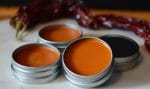 Tins of homemade Cayenne, Ginger, St John's Wort Salve for back pain