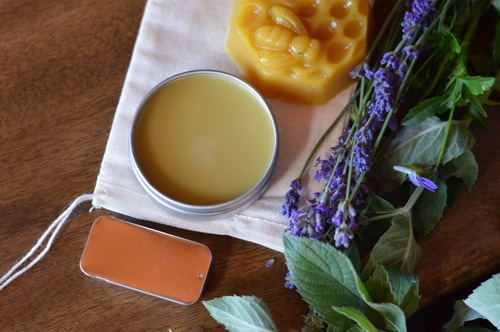 This soothing headache salve can be made from fresh lavender blossoms and peppermint leaves from your garden. If you don’t have any in your garden you can use dried leaves and dried blossoms to make this. The fragrance will be barely noticable in the finished salve but the herbs will contribute their herbal actions when in contact with the skin. The aromatic essential oils give the fragrance to this salve rather than the herbs.