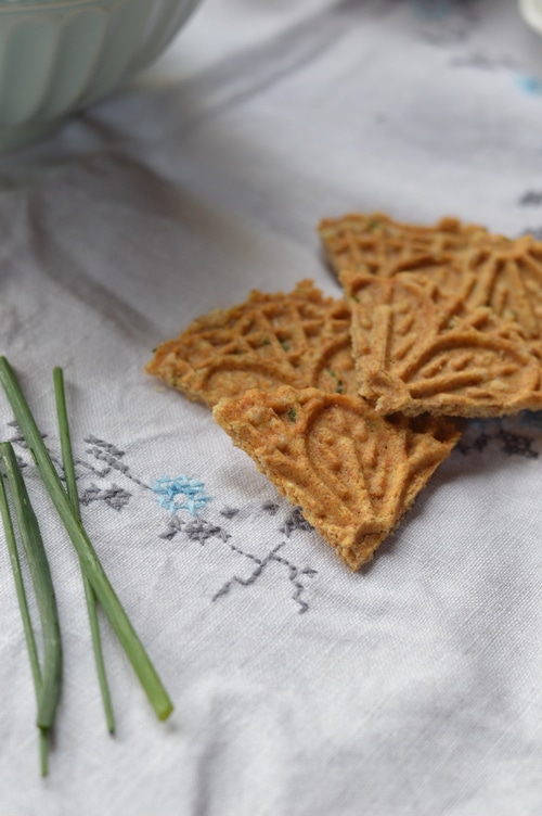 Savory pizzelles are better than the finest, high end store-bought cracker. A base of eggs, butter, flour, and baking powder can be spiced up with grated cheese, sesame seeds, flax seed, nuts, onions, garlic, fresh herbs, lemon peel, or spices. And the recipe is enough to please 4 to 6 people for appetizers. Double the recipe for a bigger audience.