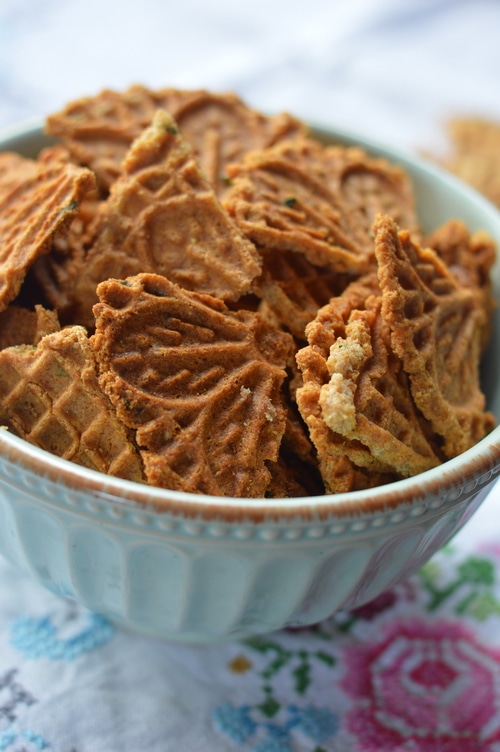 Savory pizzelles are better than the finest, high end store-bought cracker. A base of eggs, butter, flour, and baking powder can be spiced up with grated cheese, sesame seeds, flax seed, nuts, onions, garlic, fresh herbs, lemon peel, or spices. And the recipe is enough to please 4 to 6 people for appetizers. Double the recipe for a bigger audience.