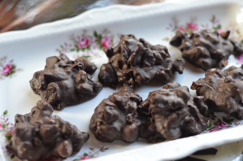 Professionals create chocolates that have snap, sheen, and a smooth mouth feel. Their chocolates don’t have streaks. The texture is crisp rather than crumbly. The secret that professional chocolatiers know that amateurs don’t has to do with tempering the chocolate before you use it.