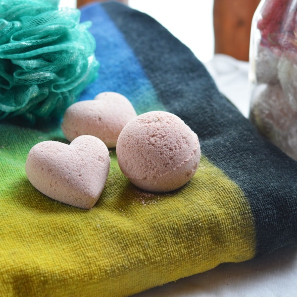 Bath bombs are a fizzy parcel of hydrotherapy in a joyful single serving portion. The dry bath bomb enters the bath tub and immediately erupts in fizzy, foaming delight that is reminiscent of the volcano demonstrations at grade one science fairs. However, the bath bomb is even more wonderful because it explodes with fragrance and herbal goodness, moving a mundane bath into the realm of therapeutic delight. But even though they are wonderful, soothing, and fragrant, the technique necessary to make them at home is difficult to master.