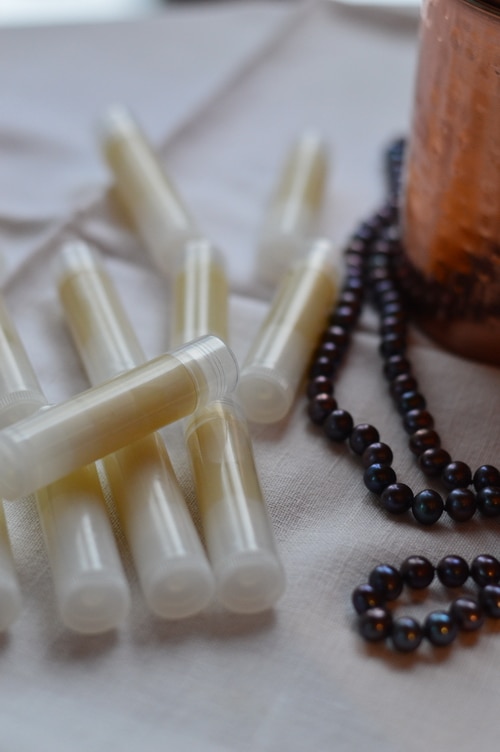 Winter lip balm is a softer product than summer lip balm. It’s intended to stay softer at room temperature so that it is easy to apply to the lips, even in outdoor winter temperatures. You’ll want to keep your unopened winter lip balms in a cool cupboard so that they stay solid. Don’t store them near the wood stove.
