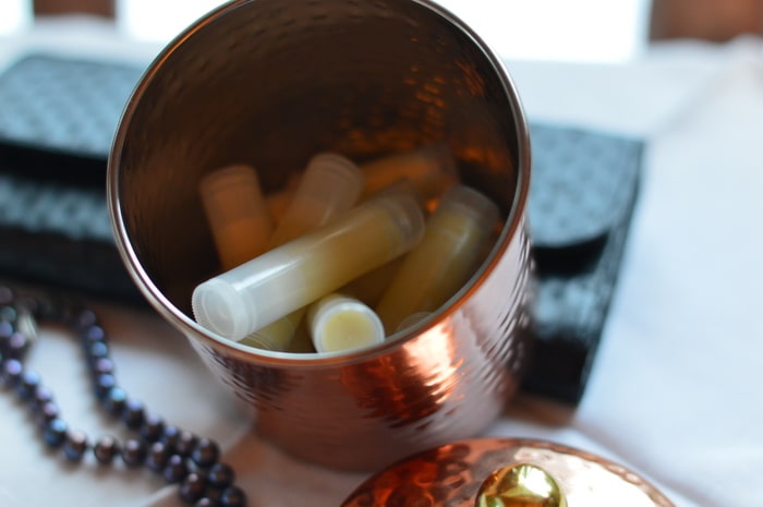 Winter lip balm is a softer product than summer lip balm. It’s intended to stay softer at room temperature so that it is easy to apply to the lips, even in outdoor winter temperatures. You’ll want to keep your unopened winter lip balms in a cool cupboard so that they stay solid. Don’t store them near the wood stove.