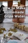 A mortar and pestle, container , baby rattle and tea bags filled with homemade gripe water