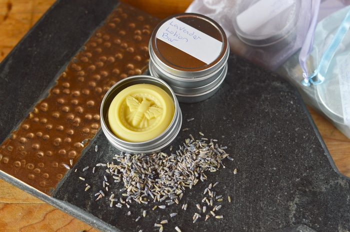 Lavender lotion bars are made with just a few ingredients but they offer long lasting protection for dry, cracked heels, rough elbows, and calloused hands. Here they are made better through the use of lavender infused oil.
