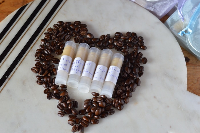 Are you tired of looking in the mirror and seeing baggy eyes, dark circles, and that “old lady” look? This DIY eye cream has natural caffeine to tighten up under eye skin, brighten those dark circles and reduce puffiness and water retention. While it won’t make you feel 20 years younger or guarantee 8 hours of sleep, it will help reduce that tired eye look that comes from late nights, not enough sleep, or water retention. Similiar commercial products sell for over  for just an ounce. But you can invest in the ingredients and make your own wonderfully fresh and nourishing beauty products for a fraction of the cost of commercial skincare products.