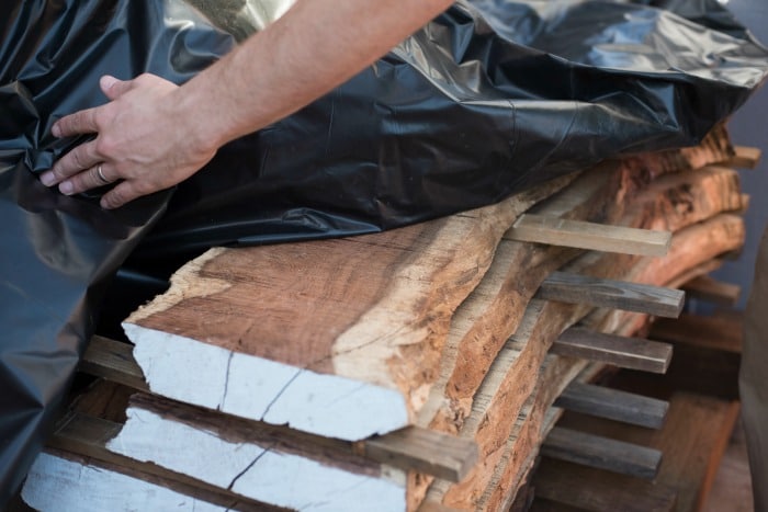 When a tree falls in an urban area a DIYer will mill it and then dry it using these best practices to season lumber from downed trees.