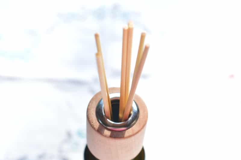 In summer the gross smells seem to hang around a little longer. The more hot and humid it is the more off-smells seem to cling. But don’t grab the toxic solid air fresheners or sprays. Instead make a reed diffuser and freshen indoor air with natural botanical essential oils. You can make one in less than 5 minutes.