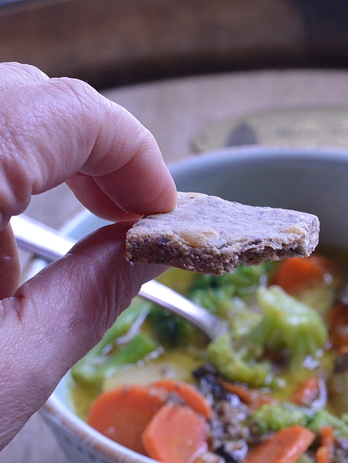 Cheesy low carb crackers are easy to make at home.  No need to pay the big bucks to get gluten-free crackers that taste like cardboard, when you can have these on the table in 40 minutes from start to finish.