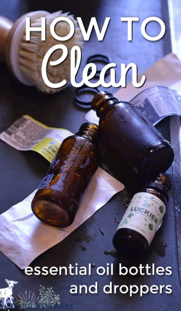 essential oil bottles with the labels removed ready for cleaning