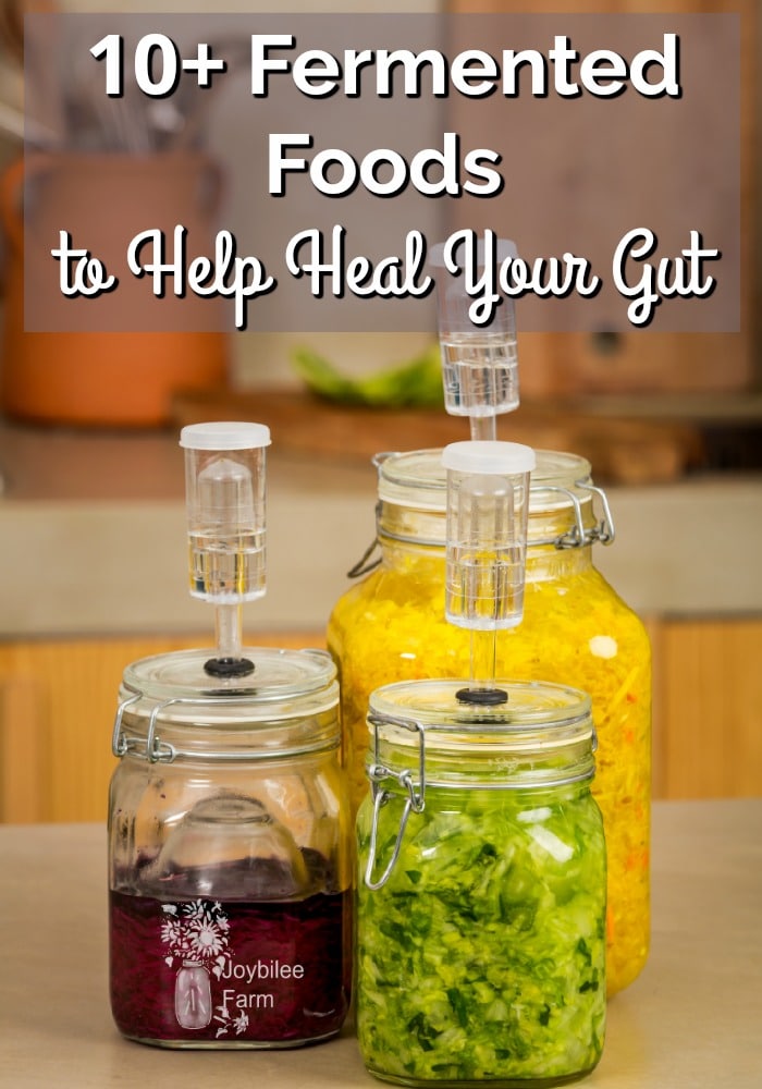 3 Mason jars filled with beautiful green, yellow and red fermenting vegetables.