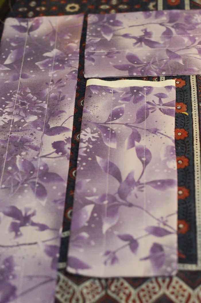 purple fabric with sewn channels for adding flaxseed