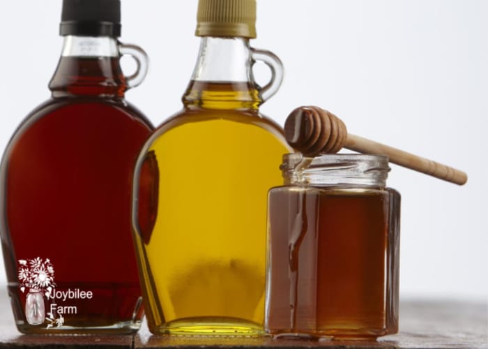 maple syrup and honey in jars