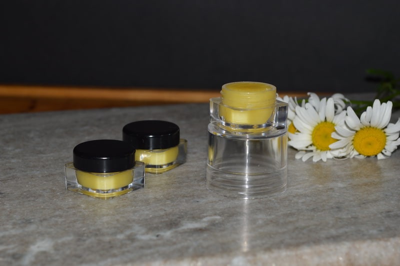 homemade solid perfume in plastic containers