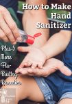 A father and son sitting on a park bench using hand sanitizer