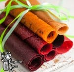 fruit leather rolled up and tied with a green ribbon