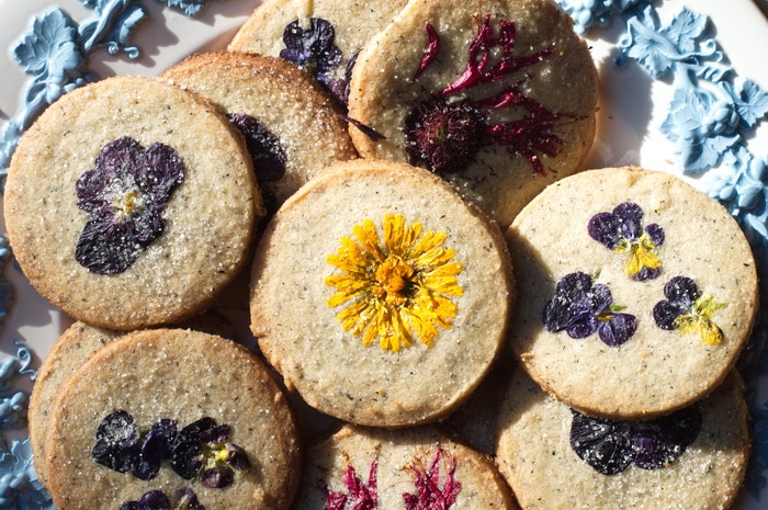 gluten free edible flower cookies on a tray