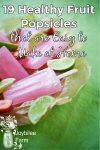 strawberry and lime popsicles in a bowl on a green background
