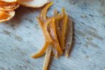 Candied orange peels on a wooden board