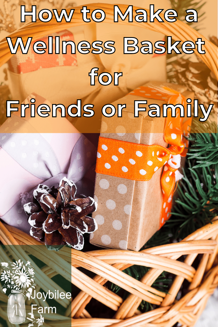 a basket of wrapped gifts with a pinecone and some greenery