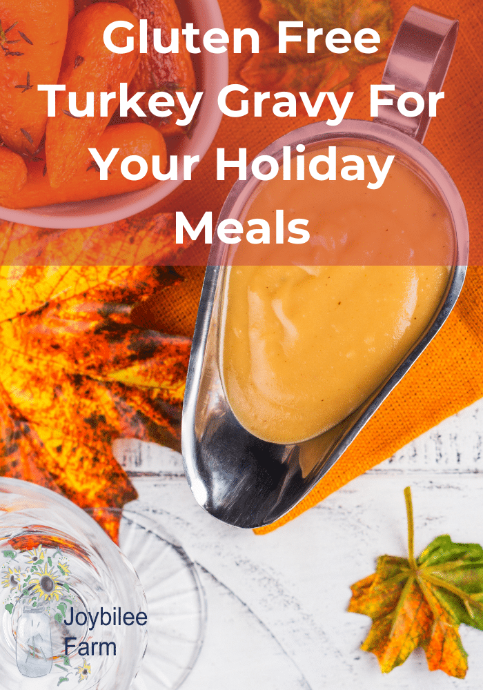 gluten free turkey gravy in a gravy boat with holiday decoration around it