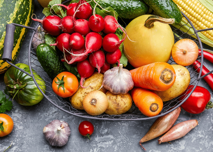 a healthy garden harvest includes garlic and other garlic companion plants