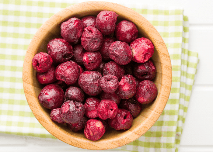 freeze dried cherries in a wooden bowl